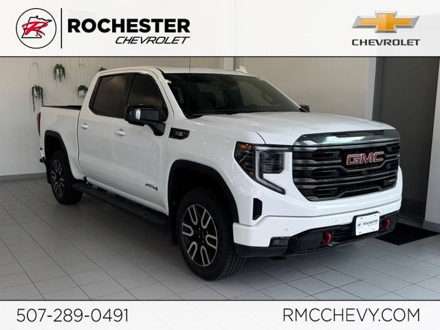 2023 GMC Sierra 1500 AT4 in Summit White — front three-quarter view