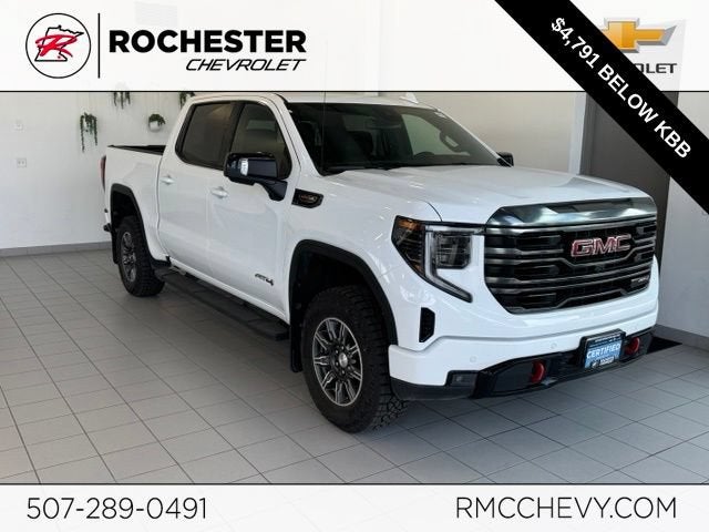 2024 GMC Sierra 1500 AT4 in Summit White — front three-quarter view