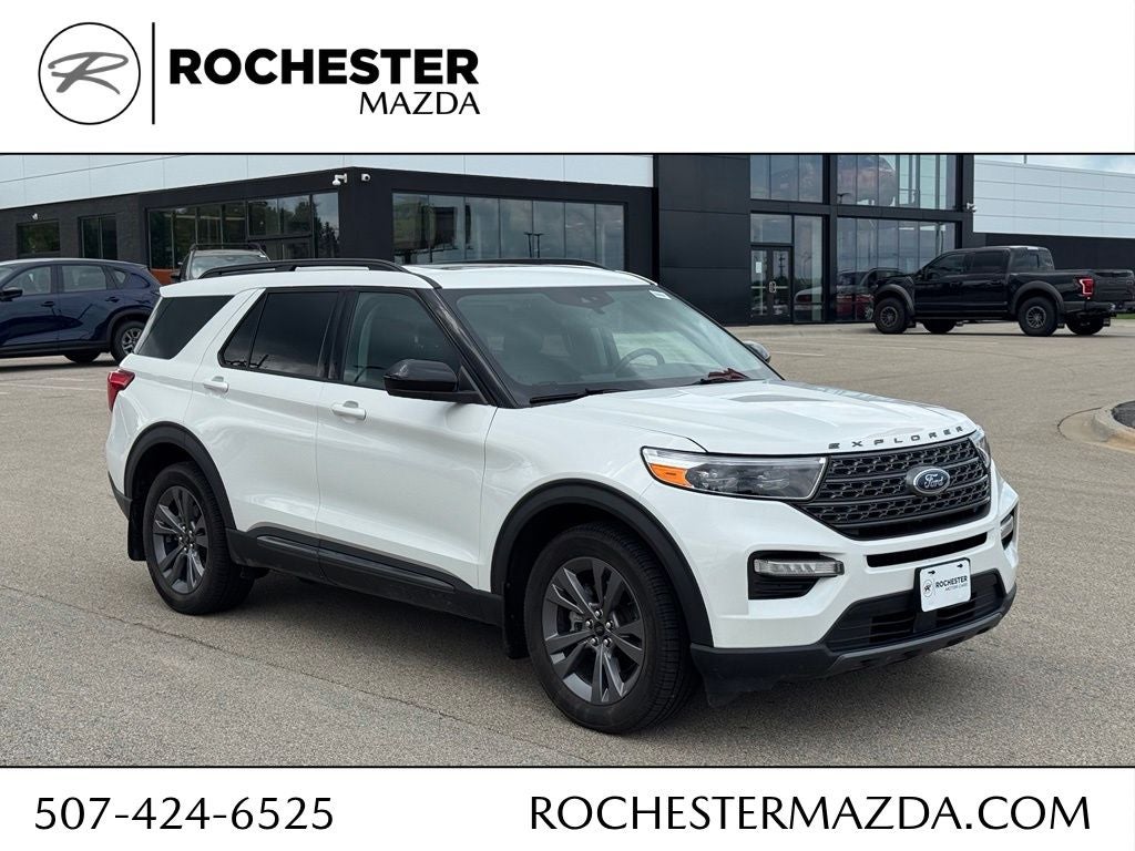 2023 Ford Explorer XLT in Star White Metallic Tri-Coat — front three-quarter view