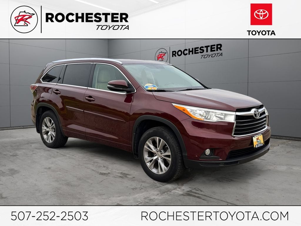 2014 Toyota Highlander XLE V6 AWD in Ooh La La Rouge Mica — front three-quarter view