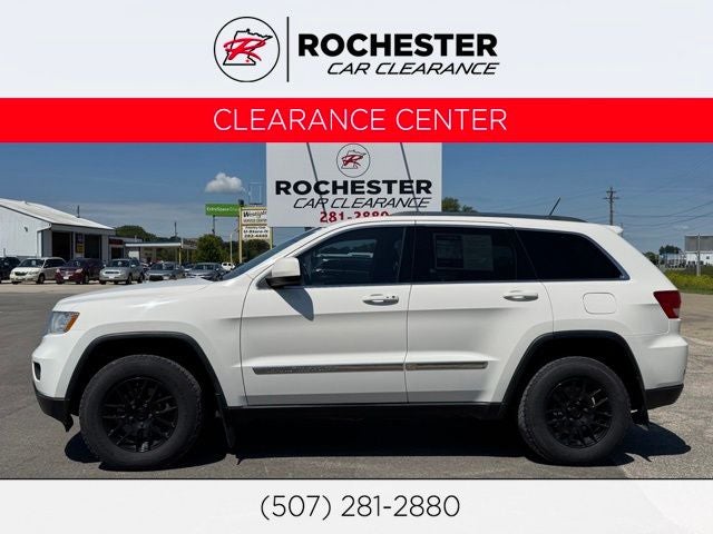 2012 Jeep Grand Cherokee Laredo in Stone White — front three-quarter view
