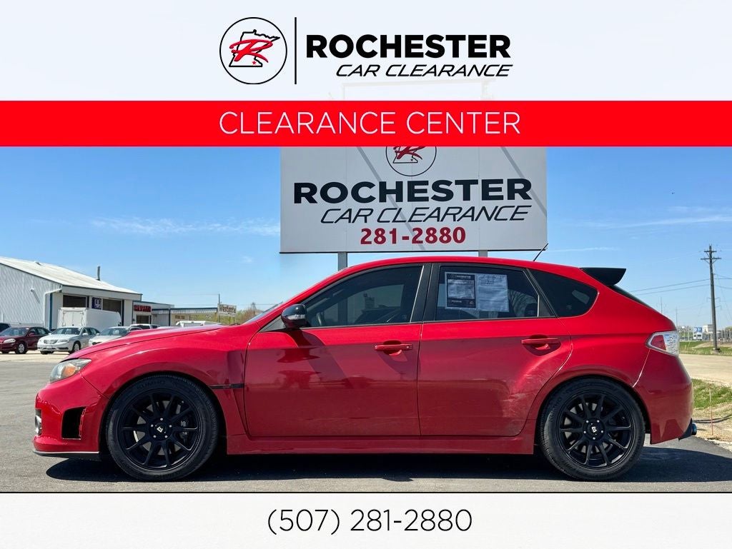 2008 Subaru Impreza WRX STi in Lightning Red — front three-quarter view
